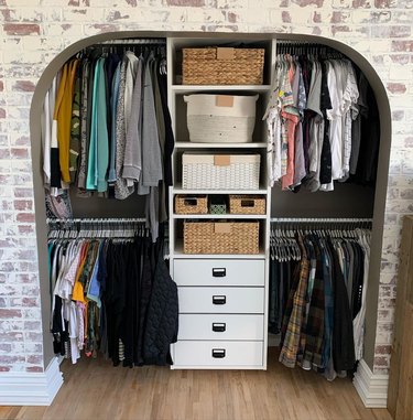 arched ikea closet with white storage