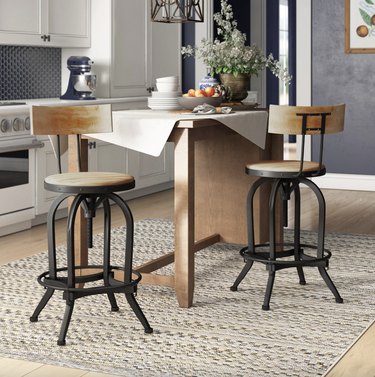 two industrial swivel stools in a kitchen