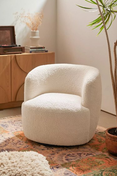 white faux sheepskin swivel chair