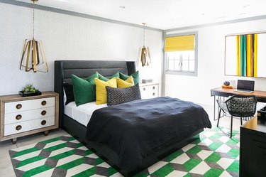 Bedroom with black, yellow and green accents.