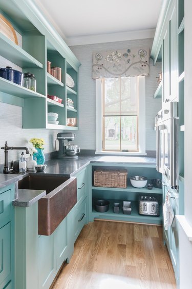 turquoise kitchen with bronze fixtures