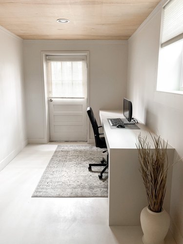 minimalist basement office with walkout and modern desk