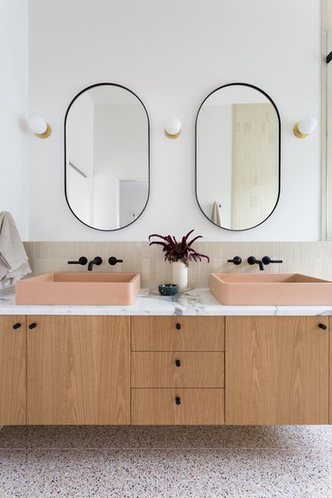 modern bathroom with peach vessel sinks