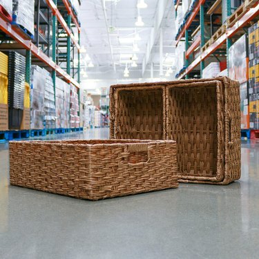Faux wicker baskets on the floor at a Costco warehouse.