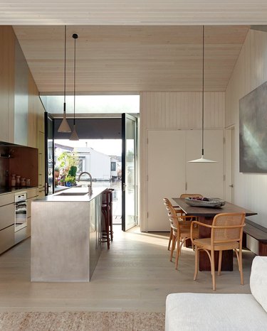 Beige kitchen with pewter island.