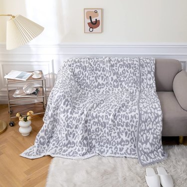 leopard-print blanket on loveseat