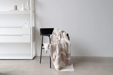 swirled soft blanket on chair