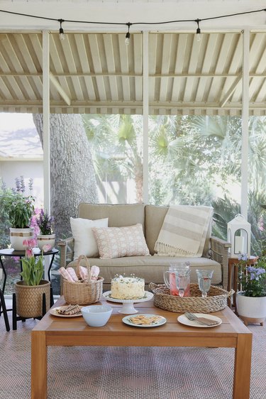 Cottagecore spring patio styled with pastel decor and cottage garden flowers