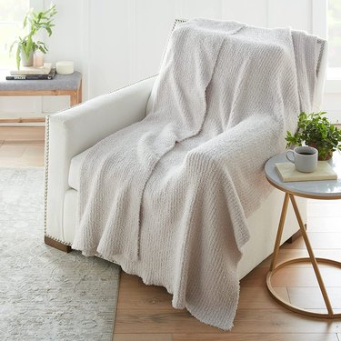ribbed cream blanket on chair