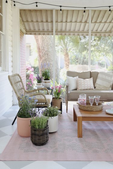 Cottagecore spring patio styled with pastel decor and cottage garden flowers