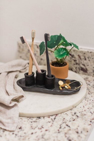 Paint the toothbrush holder and put it to work at your bathroom sink!