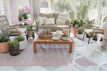 Cottagecore spring patio styled with pastel decor and cottage garden flowers