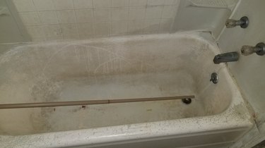A very dirty tub in a rental apartment