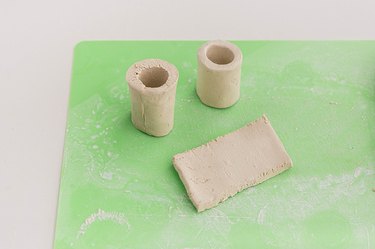 Turn the clay strips into cylinders.