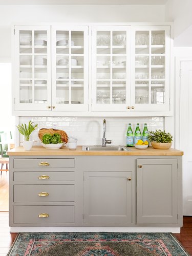 Kitchen with pewter lower cabinets and white uppers