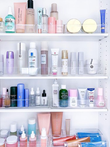 Close up of skincare products in medicine cabinet.