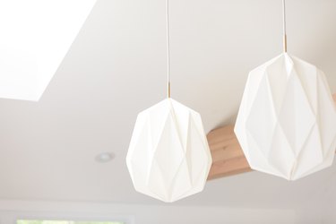 White linen pendant lights hanging in kitchen