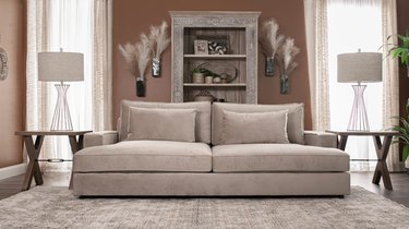 tan suede sofa in neutral living room