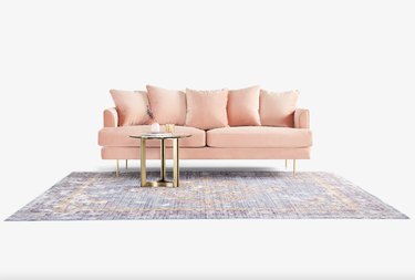 pink sofa in velvet with rug
