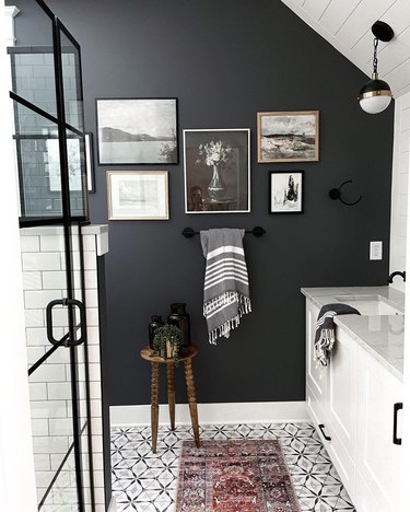 modern farmhouse bathroom idea with gridded shower, black accent gallery wall and mosaic tile