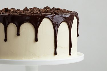 Frosted cake with chocolate topping
