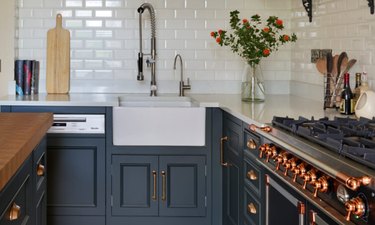 navy kitchen with rose gold details