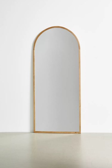 gold arch floor mirror
