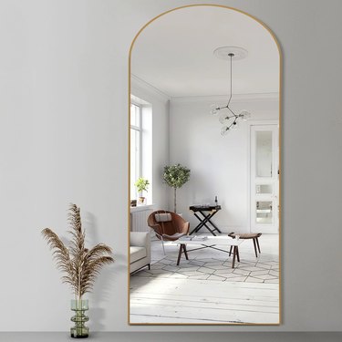 arch gold mirror on wall