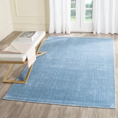 light blue rug