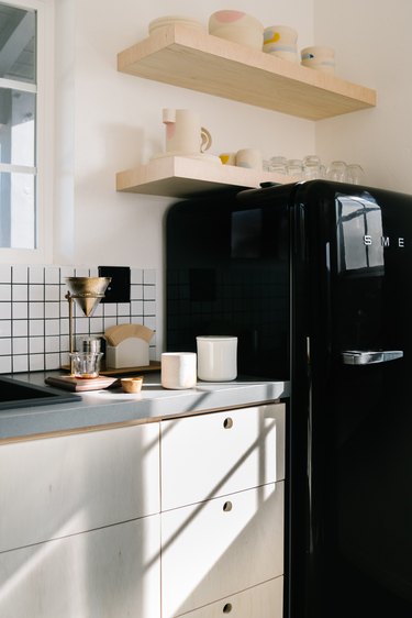 black appliances with light oak cabinets