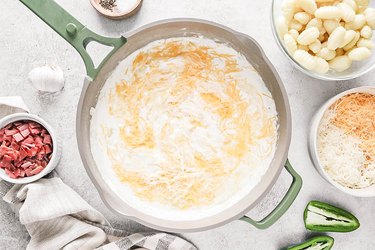 Cream sauce with cheese in a skillet