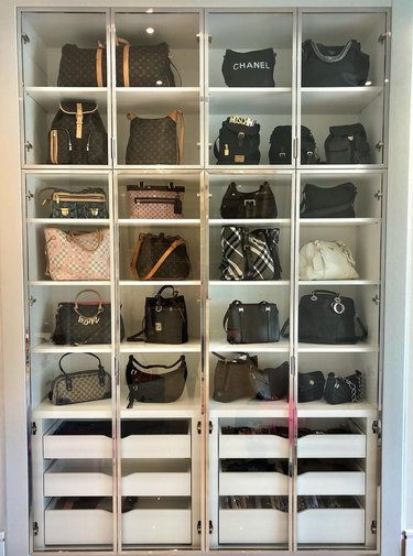 Purses organized in closet.
