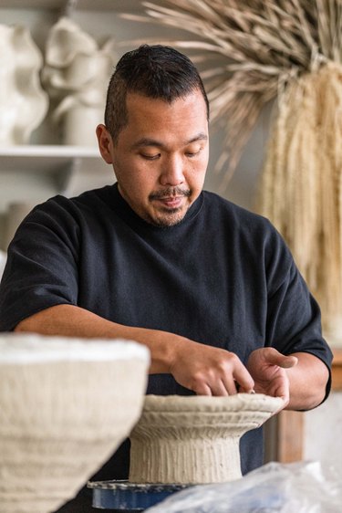 Dodie Sy at work in his studio