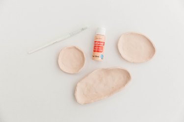 Allow the clay to fully dry out and then paint your foundation color on.