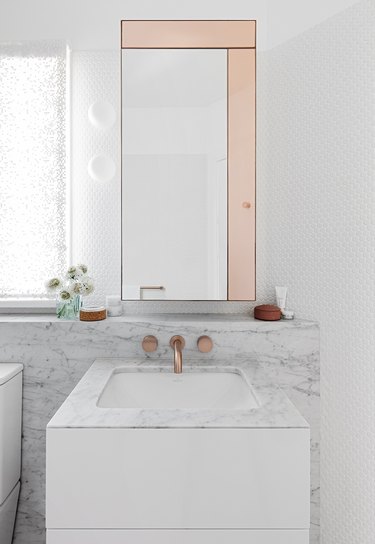 rose gold and white bathroom color idea