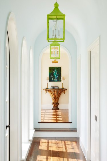 white hallway with lime green lighting