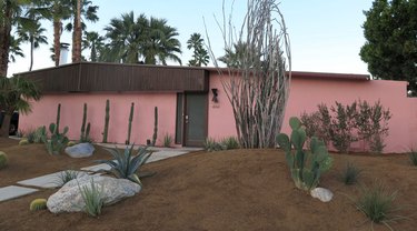 pink house with brown roof