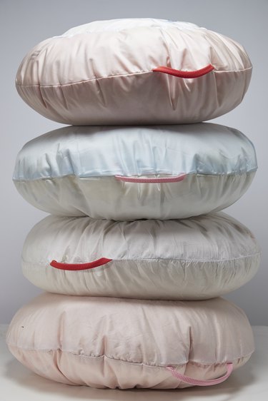 stack of four round pillows made from airbags