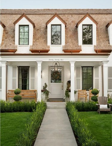 white house with brown roof