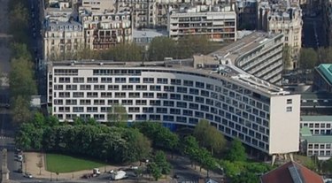 Arial view of a large building with three wings