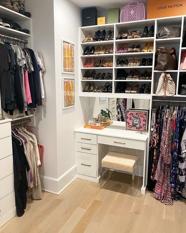 Closet space with shelves and small desk area.