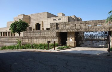 The Ennis House, a large concrete geometric house with a gated driveway.