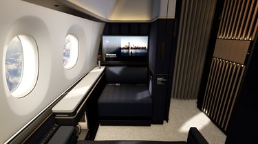A small room on an airplane with a black leather chair and round window open to the sky
