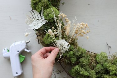 Gluing dried floral to hide floral wire