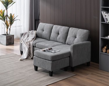small gray sectional in neutral living room