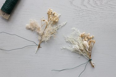 Bundles of dried florals tied together with floral wire