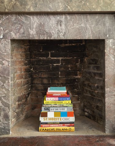 The Novogratz firebox detail with book display