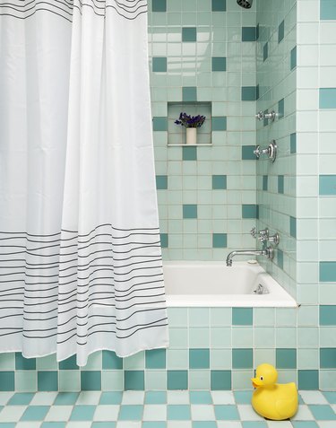 The Novogratz bathroom with aqua mosaic tile