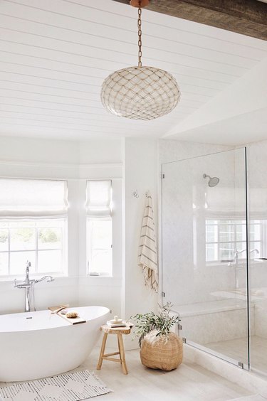 minimal bohemian bathroom lighting idea with capiz shell chandelier