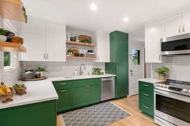 Kitchen with white and green cabinets